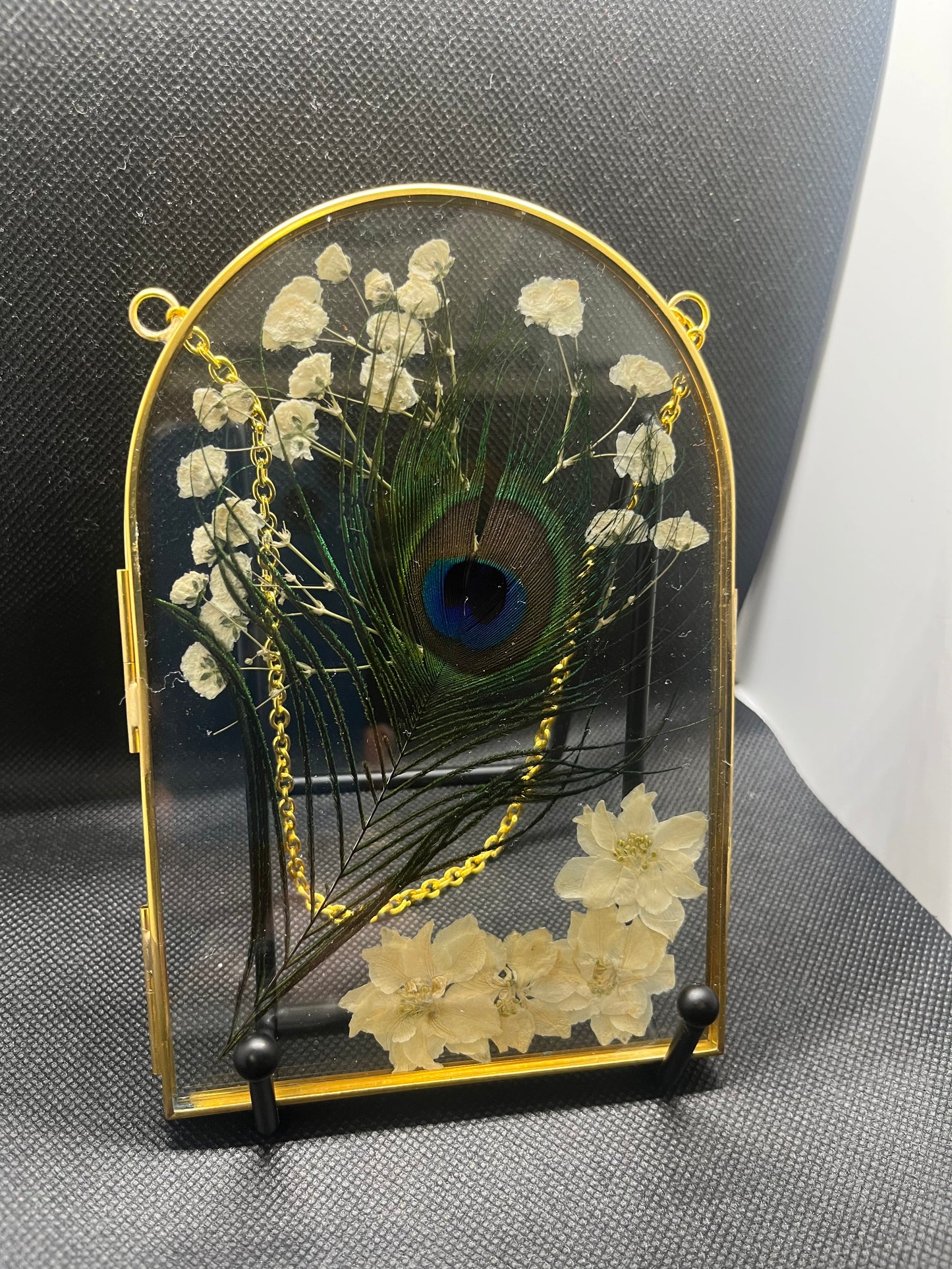 White floral with peacock feather